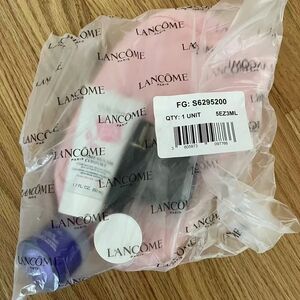 Lancôme Skincare Set with Pink, Black, and Purple Bottles
